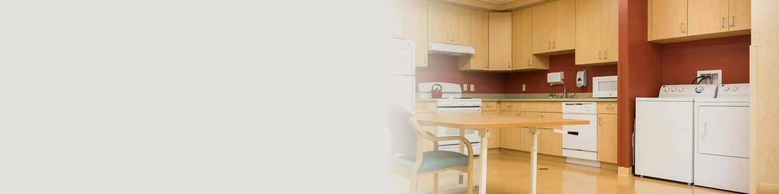 A kitchenette and washing machine at Monroeville